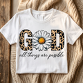 God all things are possible leopard and daisy design on a white T-shirt