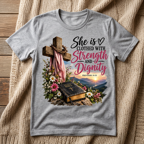 Strength and Dignity Proverbs 31:25 design on a gray T-shirt in a cozy setting